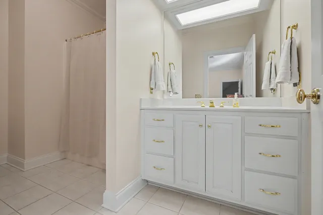 a view of a house with swimming pool and sitting area