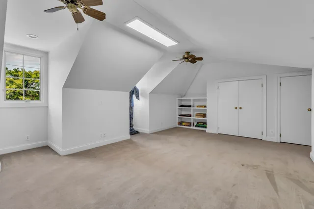 a view of a house with pool and sitting area