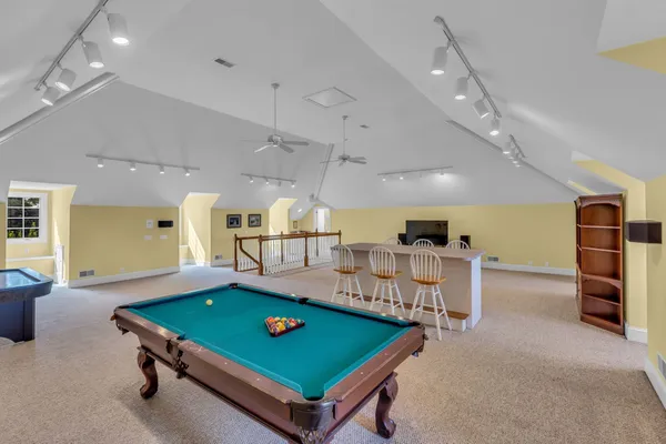 an aerial view of a house with garden space sitting space and swimming pool