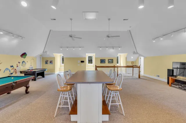 an aerial view of a house with outdoor space and street view