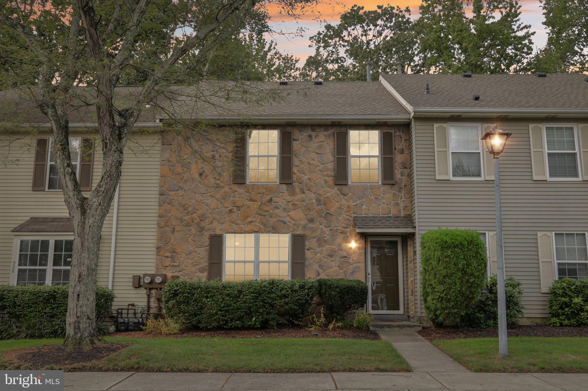 329 Gwynedd Court Mount Laurel, NJ 08054 - Photo 1 of 52 a front view of a house with garden