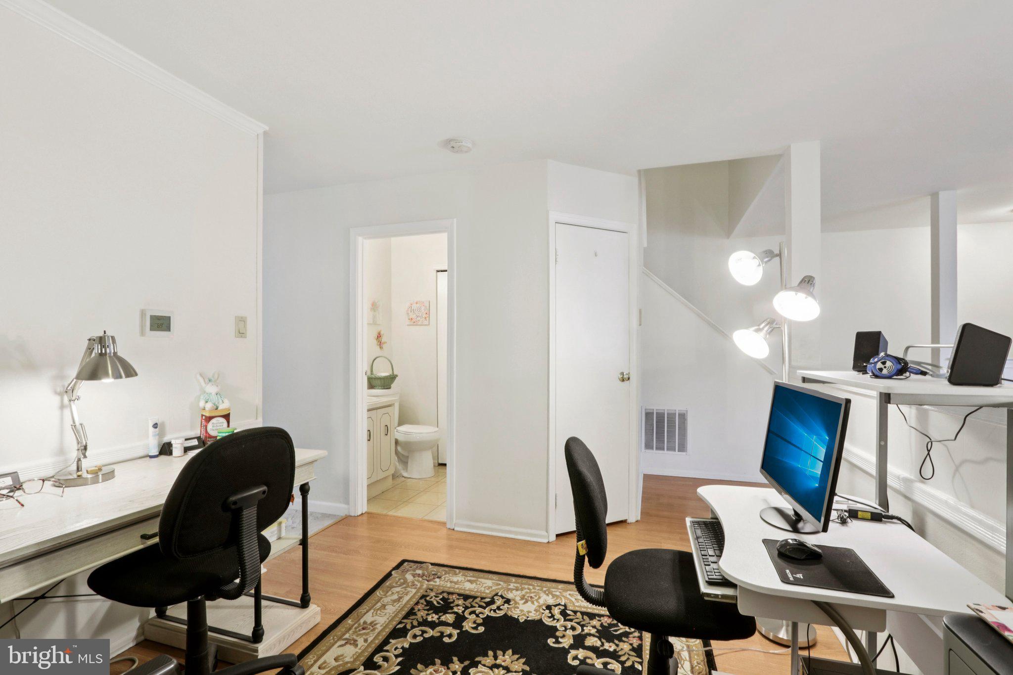 329 Gwynedd Court Mount Laurel, NJ 08054 - Photo 18 of 52 a view of a workspace with furniture and a mirror
