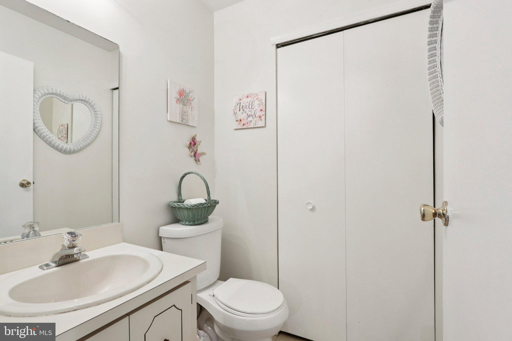 329 Gwynedd Court Mount Laurel, NJ 08054 - Photo 26 of 52 a bathroom with a toilet a sink and a mirror