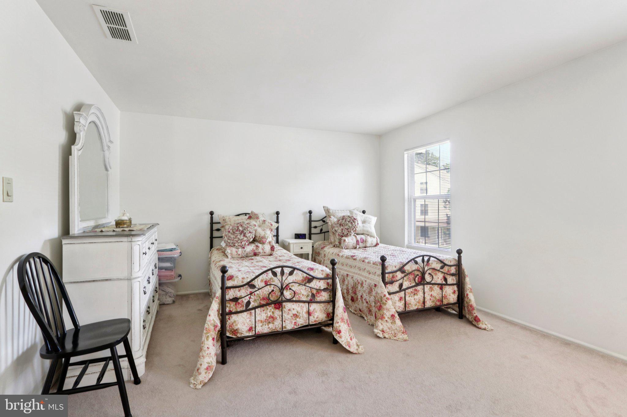 329 Gwynedd Court Mount Laurel, NJ 08054 - Photo 28 of 52 a bedroom with furniture and a large window