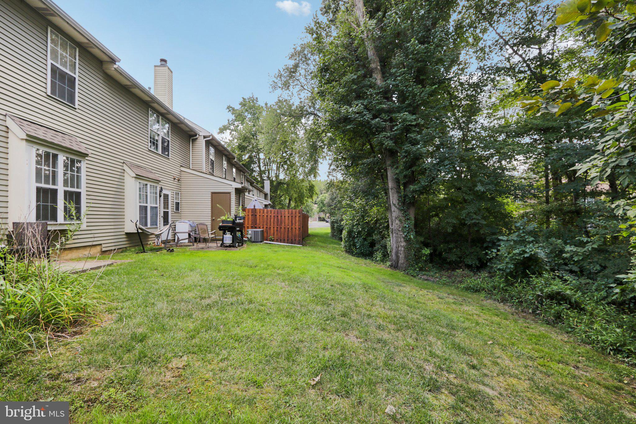 329 Gwynedd Court Mount Laurel, NJ 08054 - Photo 39 of 52 a backyard of a house with yard table and chairs