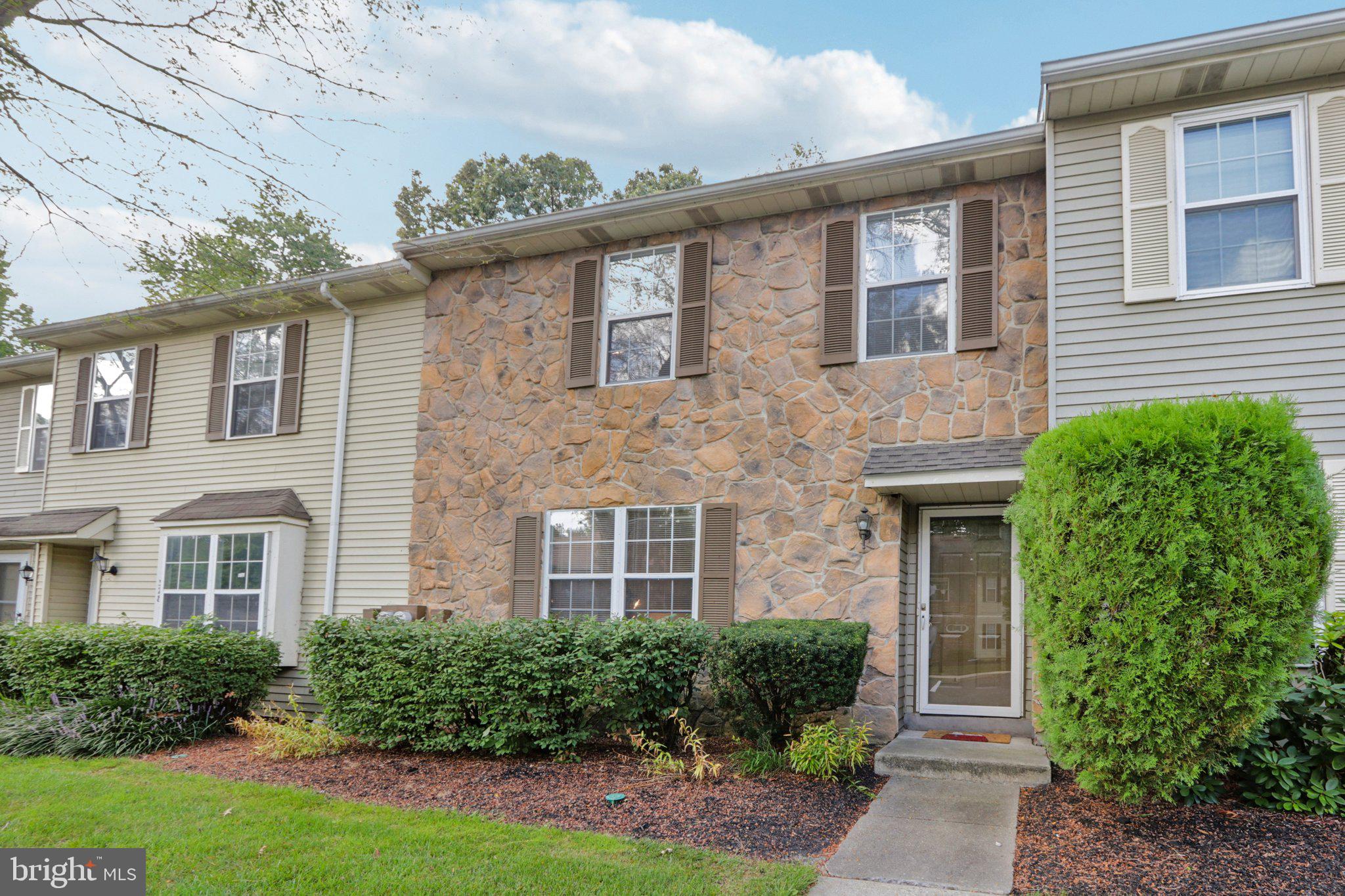 329 Gwynedd Court Mount Laurel, NJ 08054 - Photo 4 of 52 a front view of a house with garden