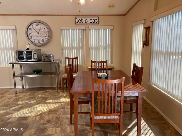 a view of a dining area with furniture and a large window