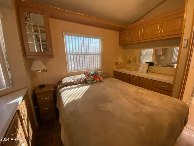 a view of a building with car parked