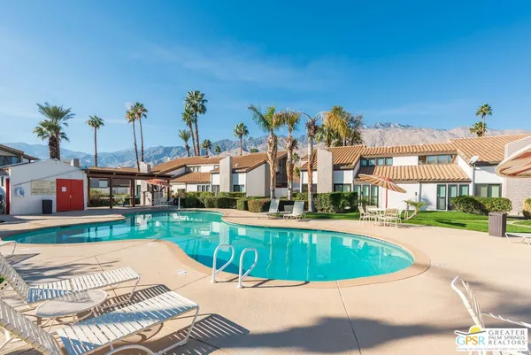 a view of a swimming pool and a yard