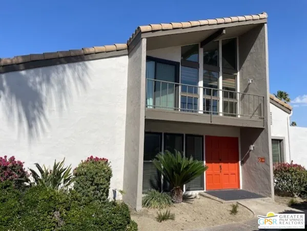 a front view of a house with a garage