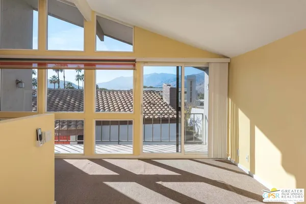 a front view of a house with a large window