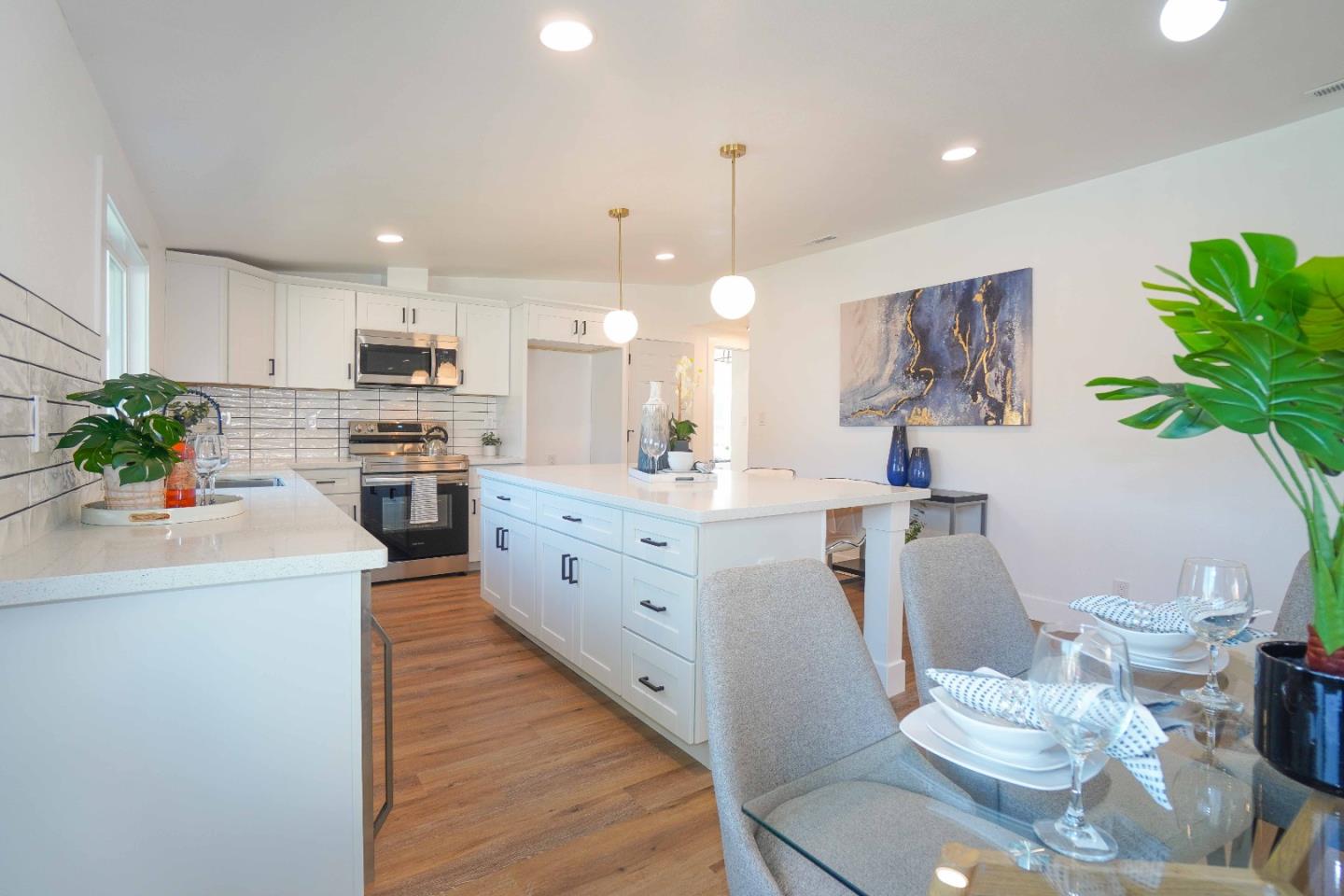 75 Lawton Drive Milpitas, CA 95035 - Photo 11 of 32 a kitchen with white cabinets and counter space