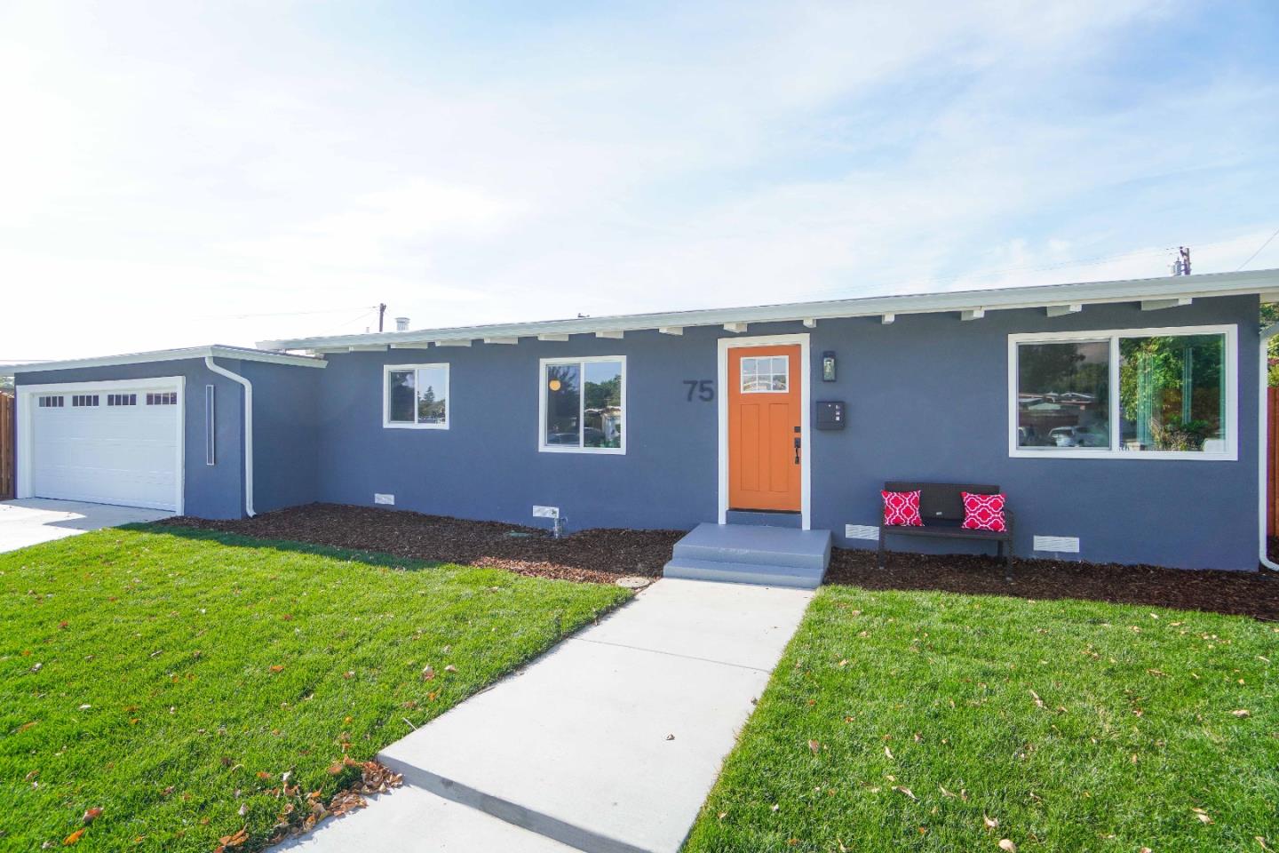 75 Lawton Drive Milpitas, CA 95035 - Photo 2 of 32 a front view of a house with a yard and garage