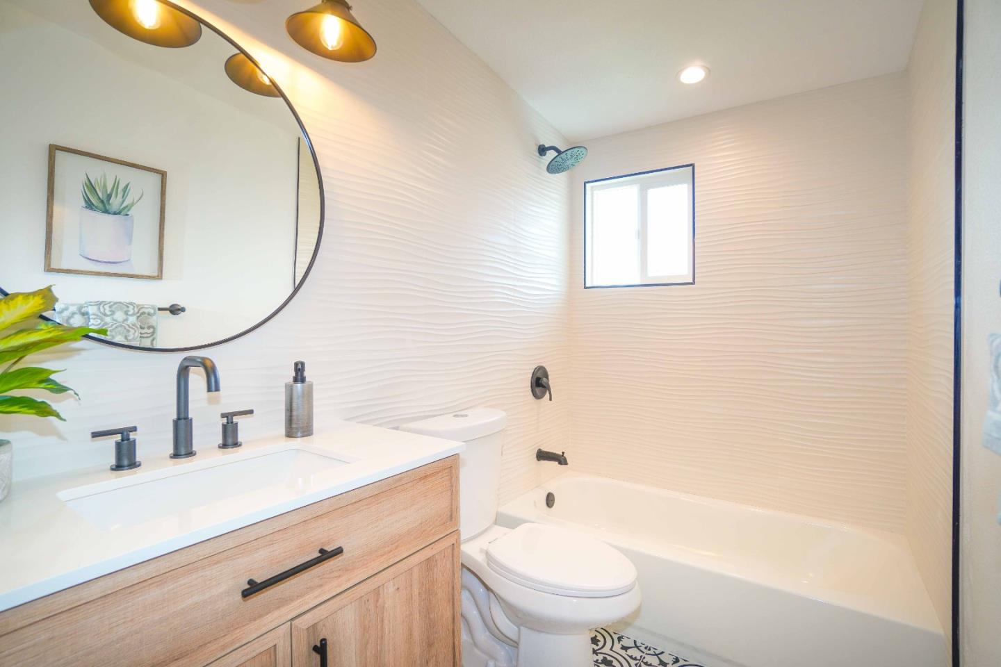 75 Lawton Drive Milpitas, CA 95035 - Photo 22 of 32 a bathroom with a sink mirror toilet and bathtub