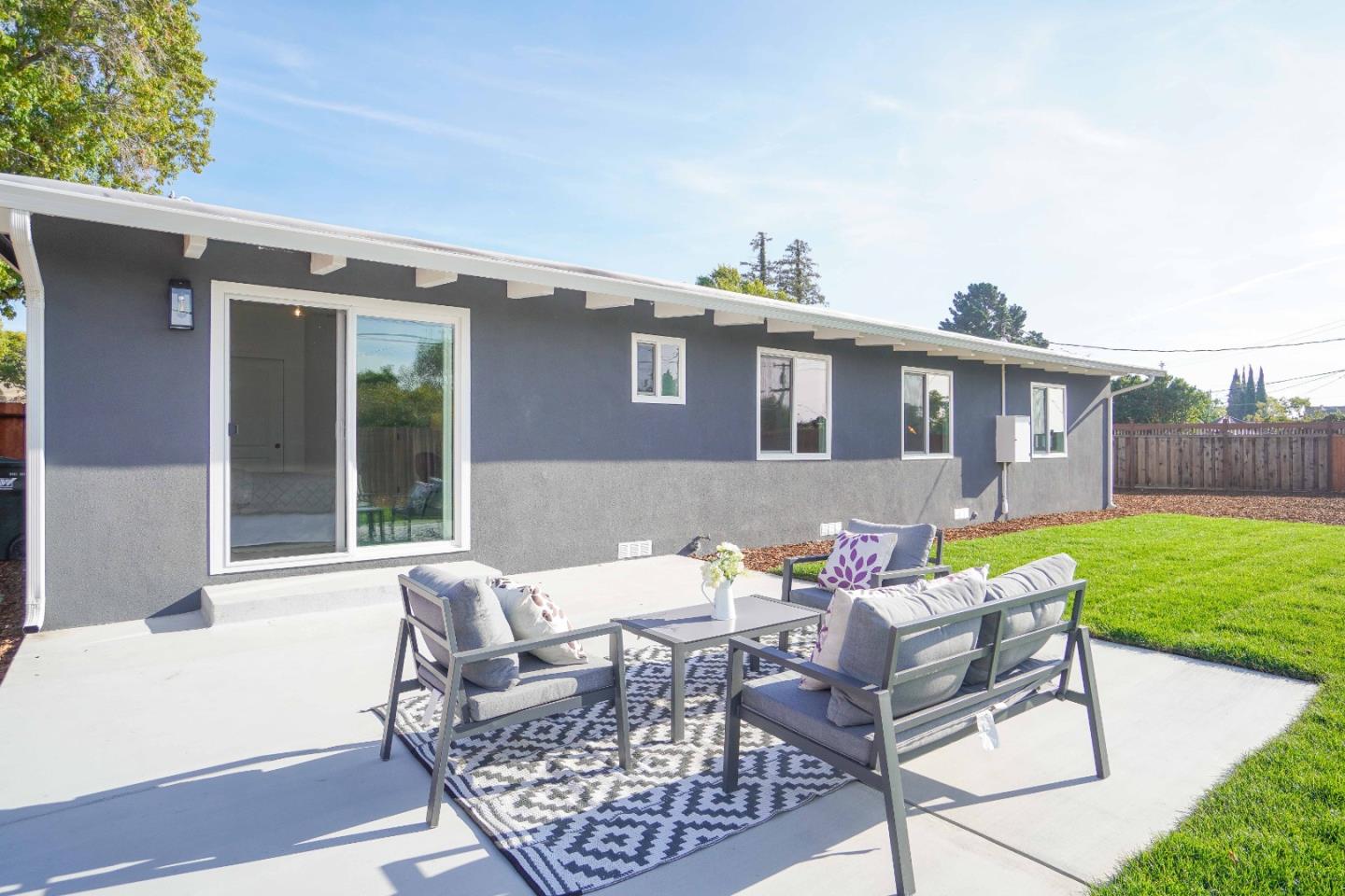 75 Lawton Drive Milpitas, CA 95035 - Photo 28 of 32 a view of a patio with couches table and chairs and potted plants