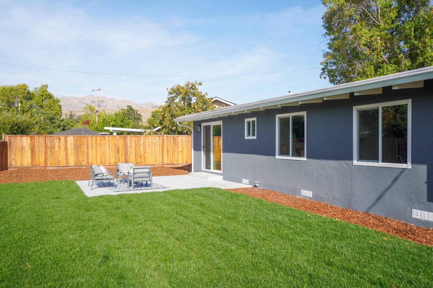 75 Lawton Drive Milpitas, CA 95035 - Photo 32 of 32 a front view of a house with a yard and a garden