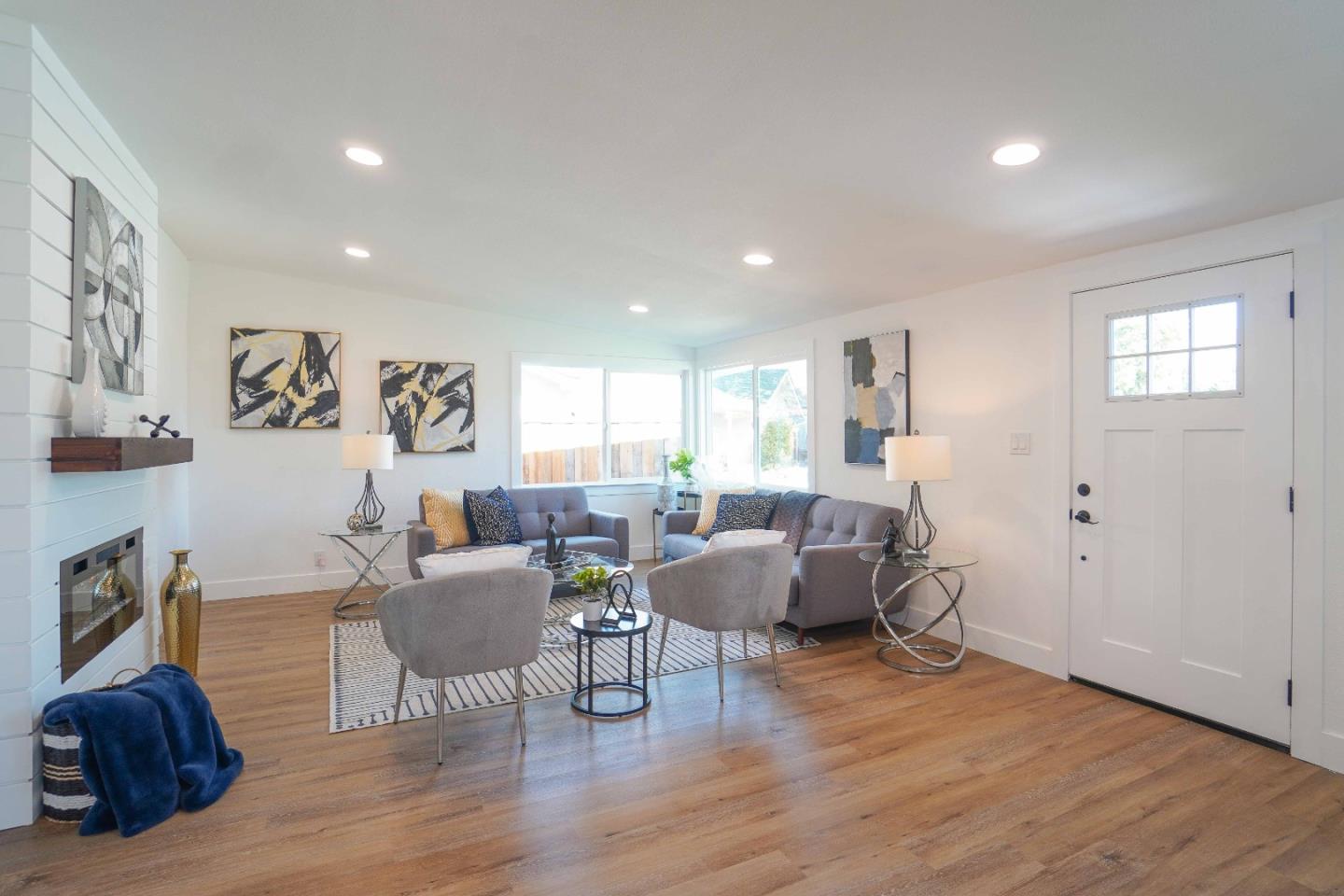 75 Lawton Drive Milpitas, CA 95035 - Photo 4 of 32 a living room with furniture and wooden floor