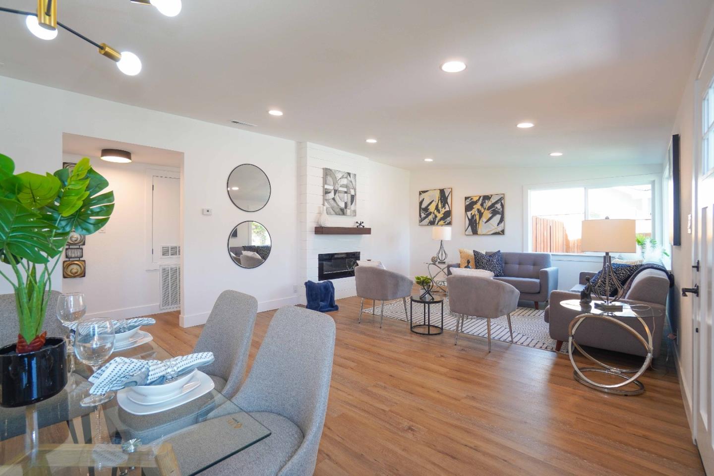 75 Lawton Drive Milpitas, CA 95035 - Photo 10 of 32 a living room with furniture kitchen view and a wooden floor
