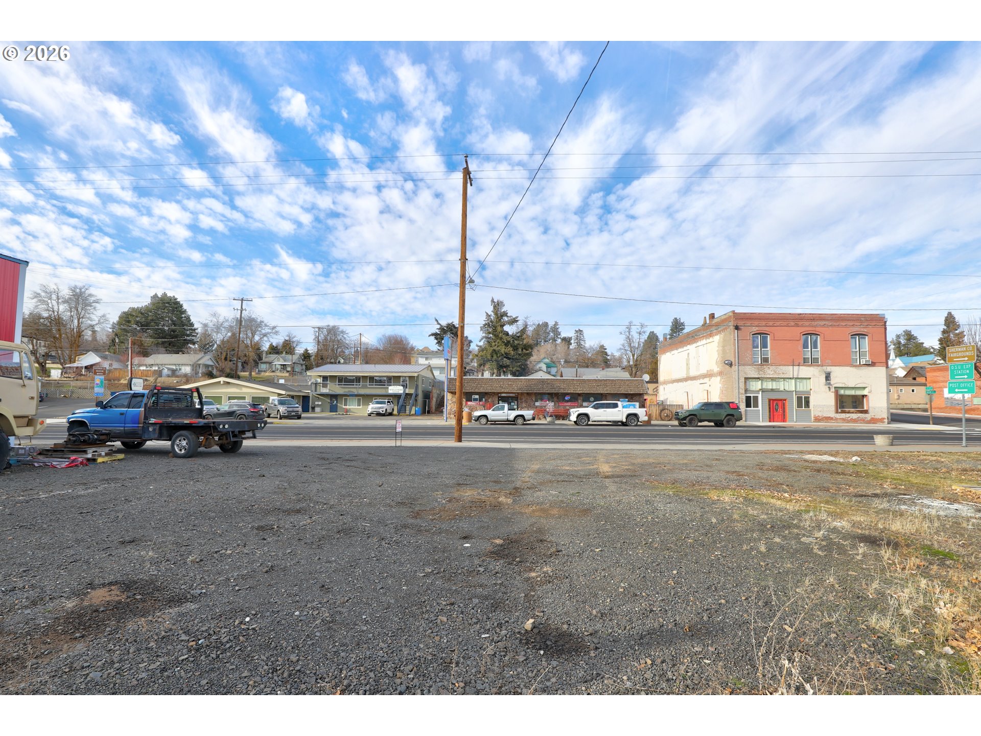 105 Main Street Moro, OR 97039 - Photo 3 of 8 a view of city street with cars parked