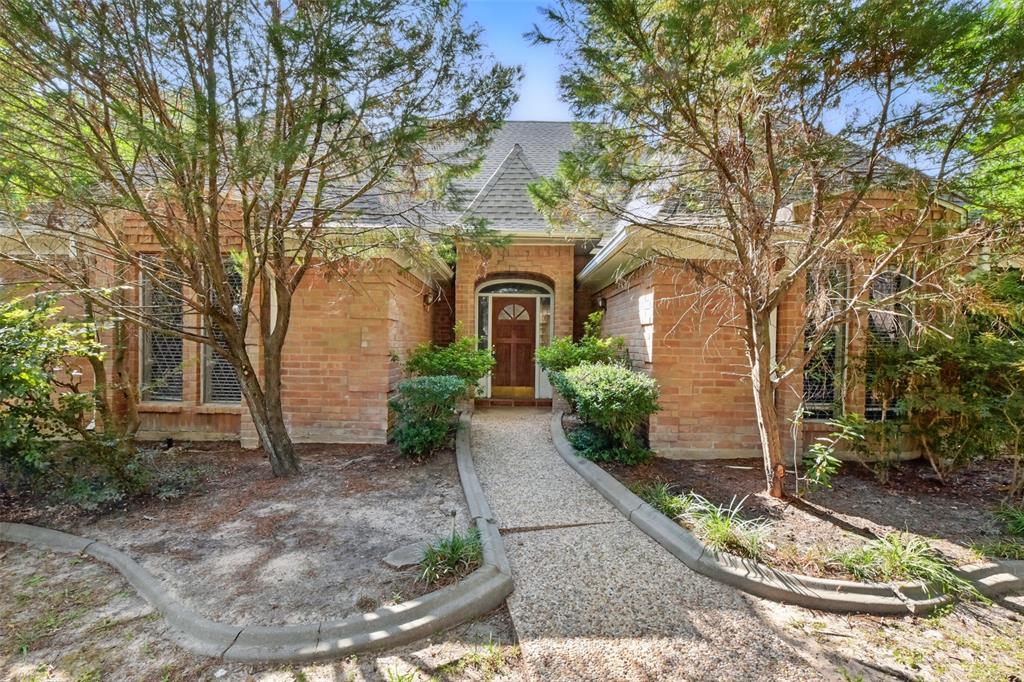 front view of a house with garden
