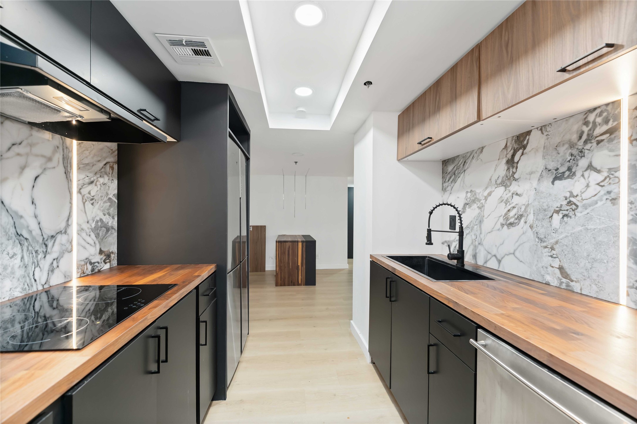 3525 Sage Road, Unit 1213 Houston, TX 77056 - Photo 2 of 26 a kitchen with stainless steel appliances granite countertop a sink and a stove