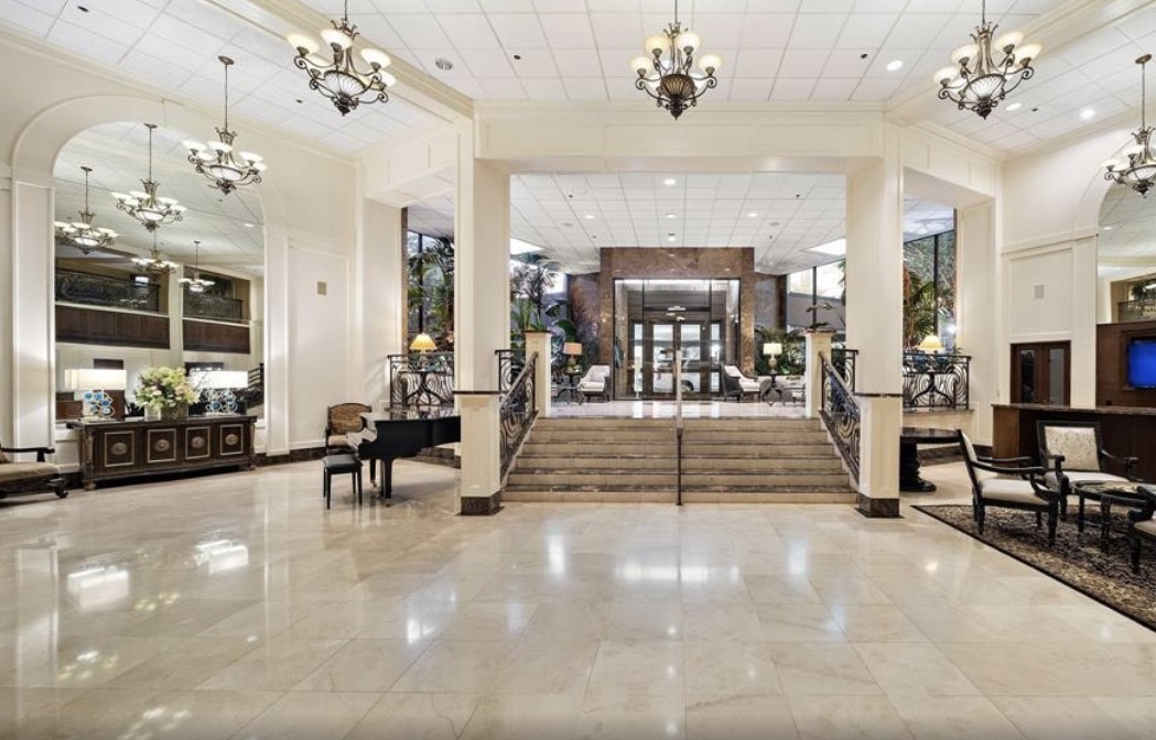 3525 Sage Road, Unit 1213 Houston, TX 77056 - Photo 21 of 26 a view of a room with lots of furniture and a chandelier