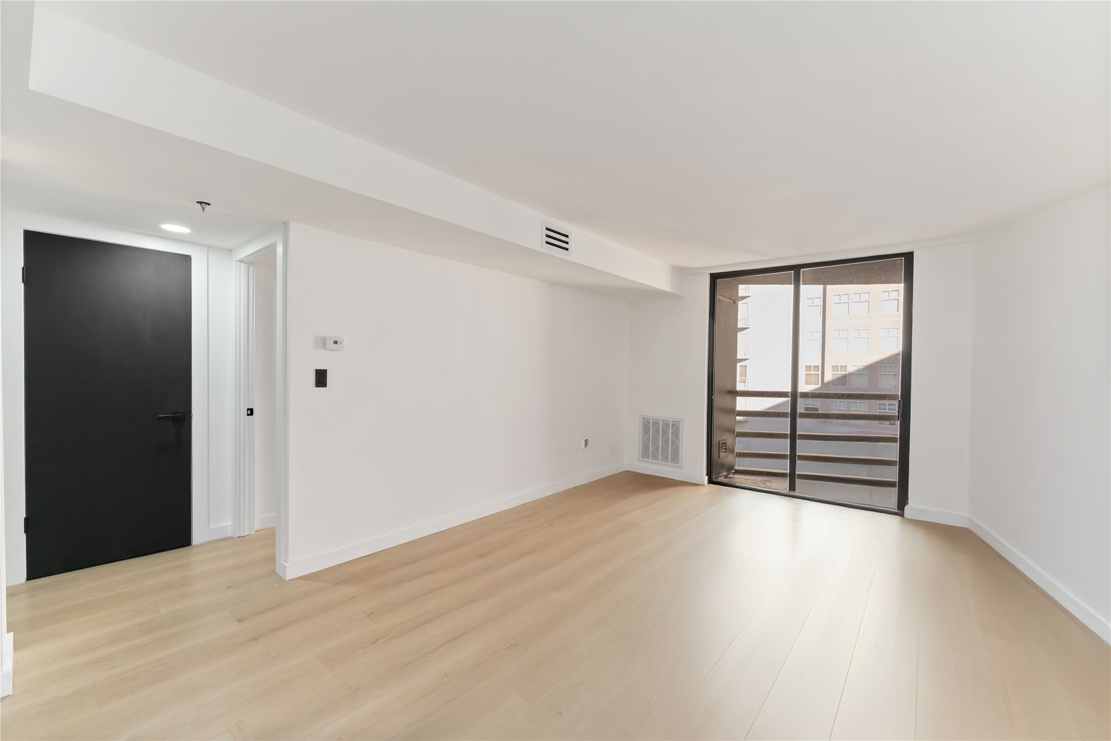 3525 Sage Road, Unit 1213 Houston, TX 77056 - Photo 7 of 26 a view of an empty room with wooden floor