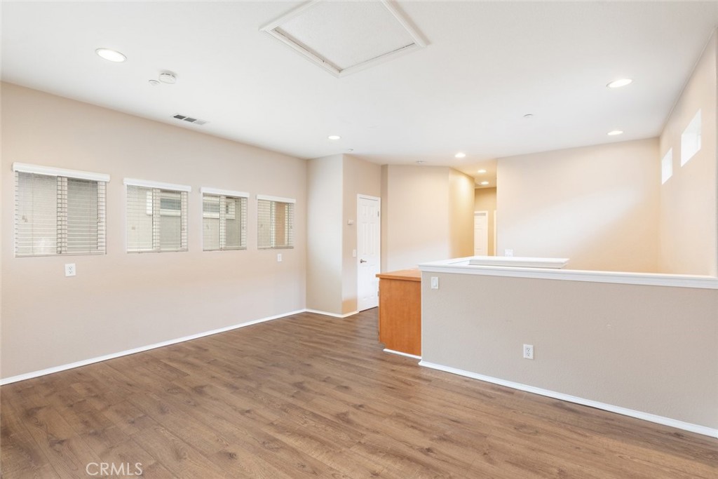 6228 Manzanita Way Riverside, CA 92504 - Photo 21 of 42 a view of empty room with wooden floor and fan