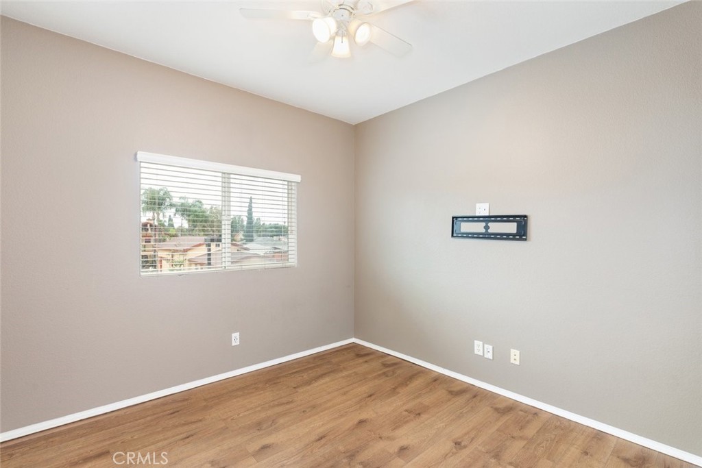 6228 Manzanita Way Riverside, CA 92504 - Photo 25 of 42 an empty room with a window and a fan