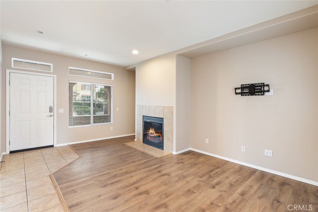 6228 Manzanita Way Riverside, CA 92504 - Photo 5 of 42 a view of an empty room with a window and a fireplace