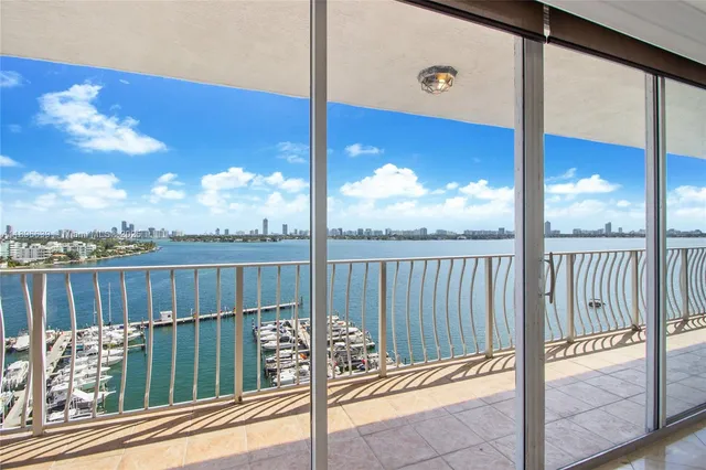 a view of a balcony with a floor to ceiling window
