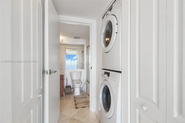 a view of a hallway with washer and dryer