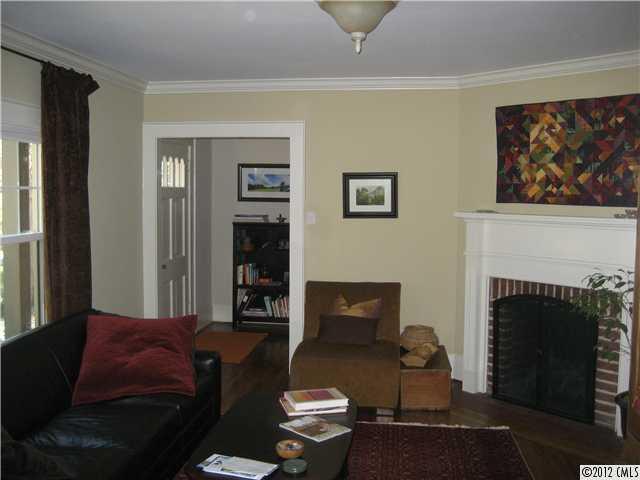 3208 Willow Oak Road Charlotte, NC 28209 - Photo 2 of 8 a living room with furniture and a fireplace