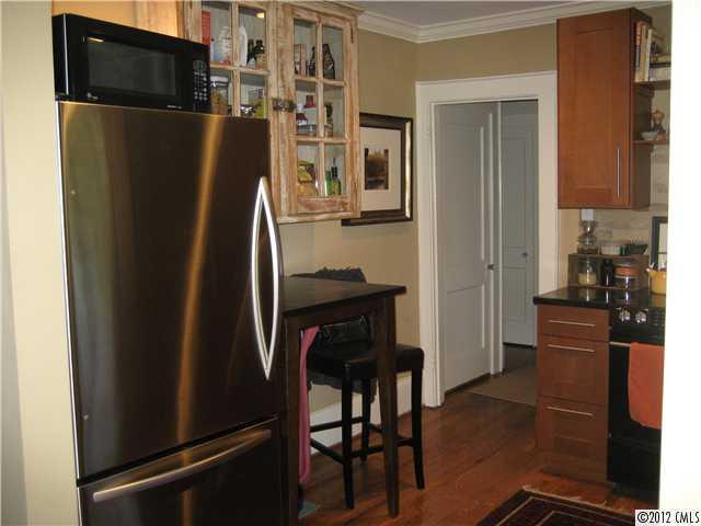 3208 Willow Oak Road Charlotte, NC 28209 - Photo 4 of 8 a metallic refrigerator freezer sitting in a kitchen