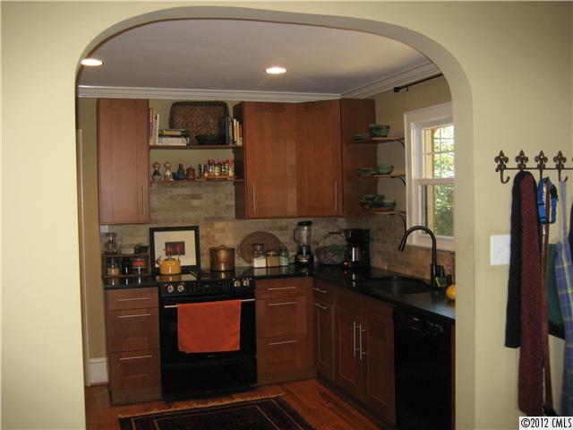 3208 Willow Oak Road Charlotte, NC 28209 - Photo 5 of 8 a kitchen with stainless steel appliances a sink stove and refrigerator
