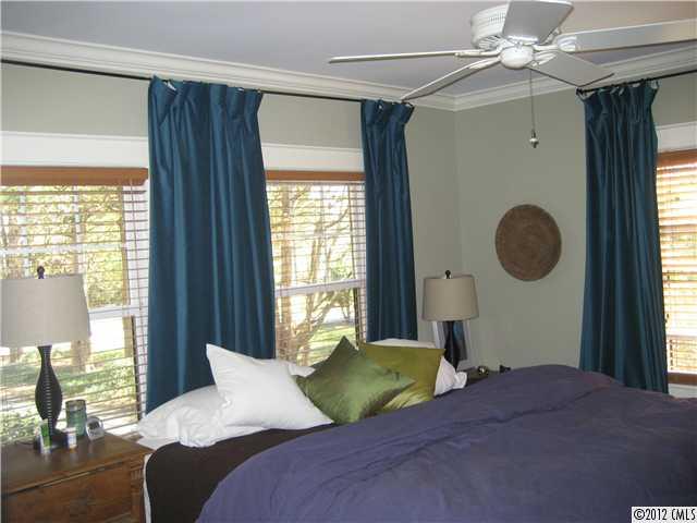 3208 Willow Oak Road Charlotte, NC 28209 - Photo 6 of 8 a bedroom with a bed and a window
