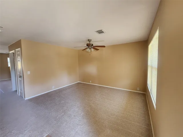 an empty room with a empty space and a hallway