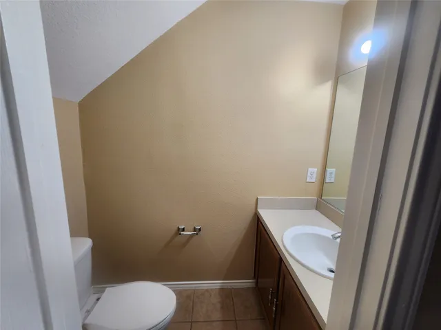 a bathroom with a sink and toilet