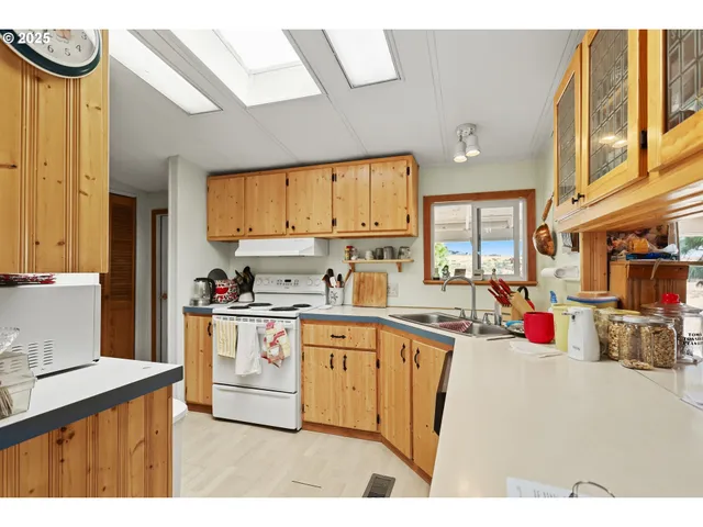 a kitchen with lots of appliances and cabinets