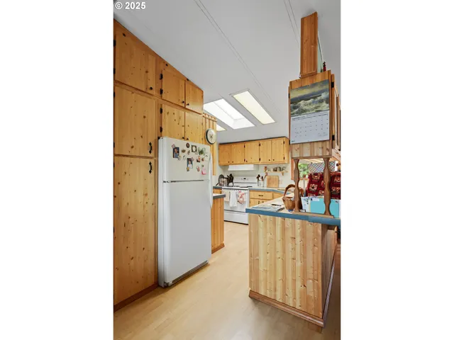 a view of a kitchen with furniture and a window