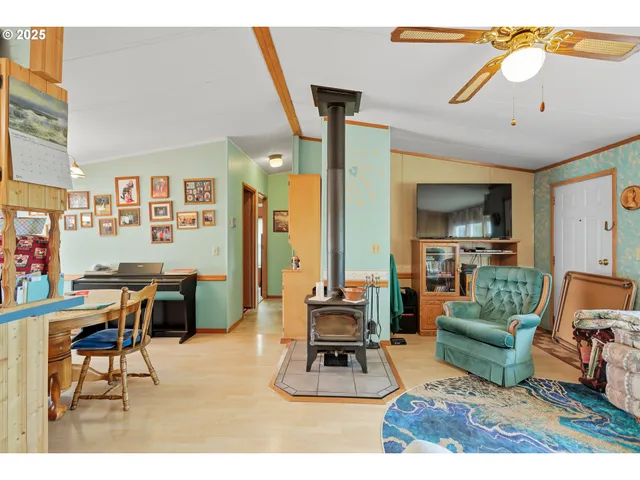 a living room with furniture and a large mirror