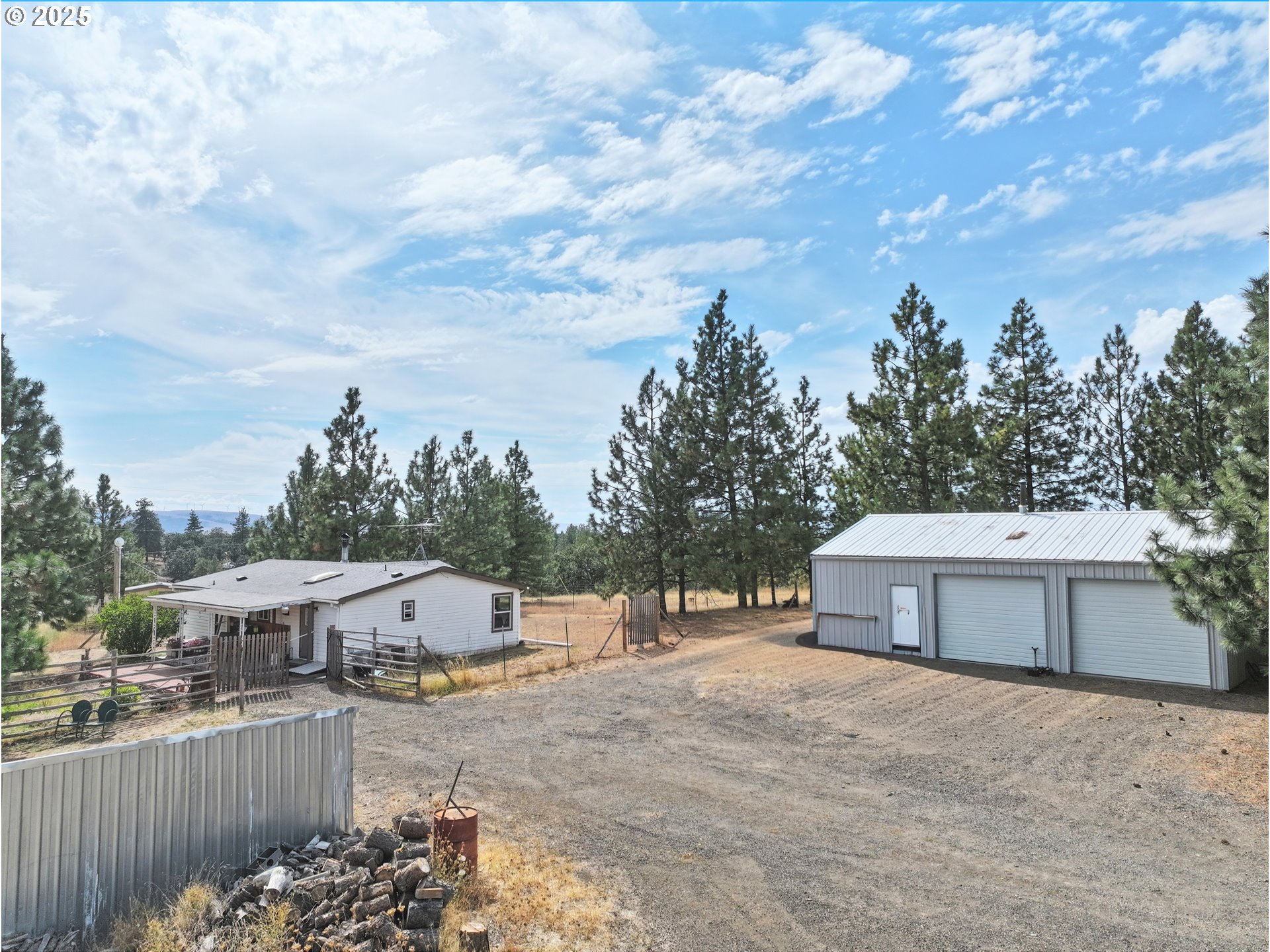 44 Pumphouse Road Goldendale, WA 98620 - Photo 26 of 35 a view of a house with a yard and fence