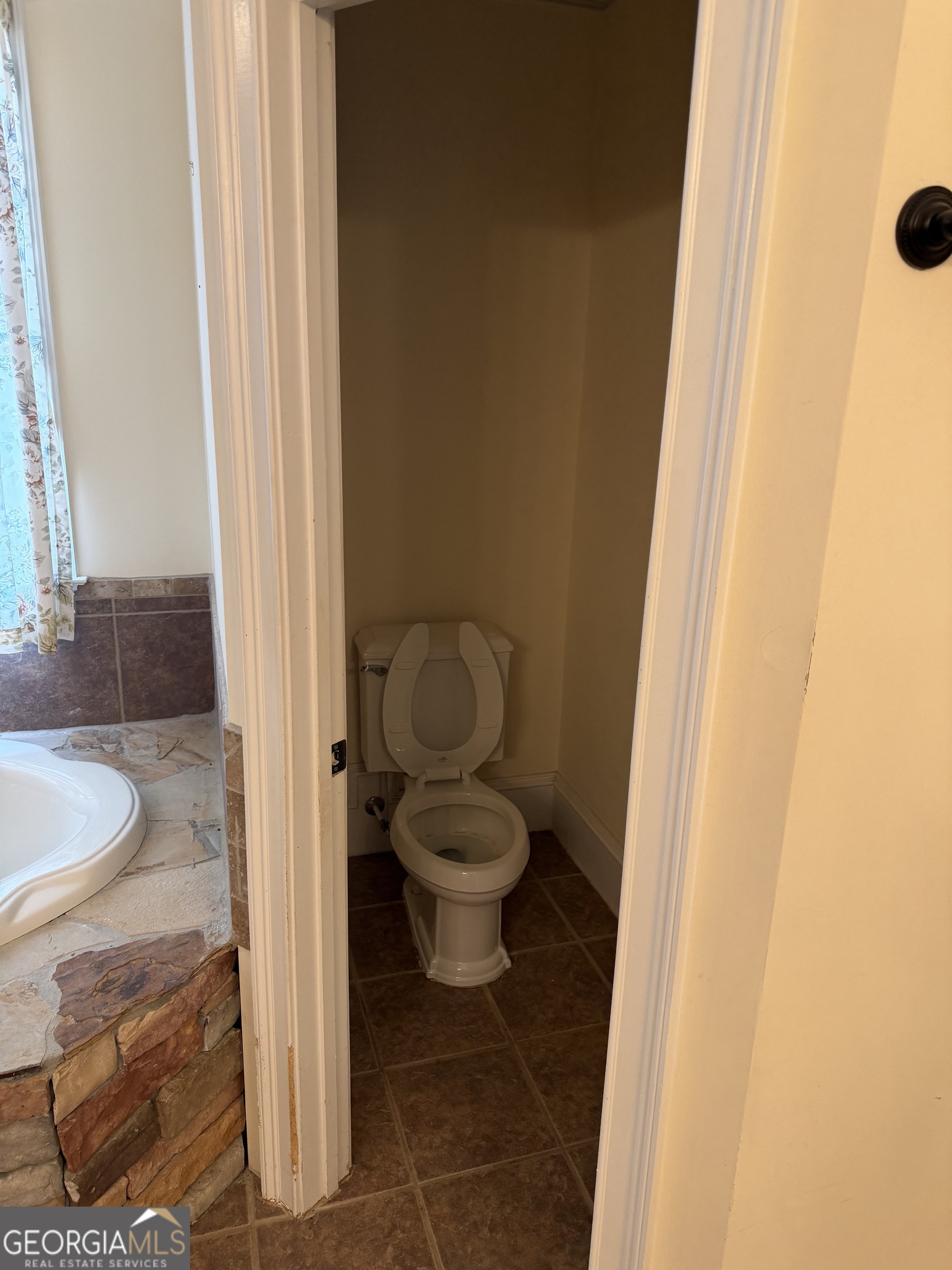 302 Norris Road Barnesville, GA 30204 - Photo 46 of 65 a bathroom with a granite countertop toilet and a sink
