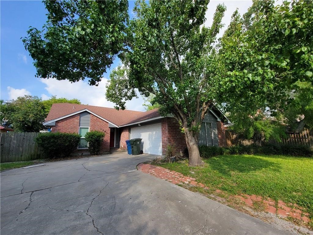 5201 Snowgoose Road Corpus Christi, TX 78413 - Photo 1 of 21 a front view of a house with garden