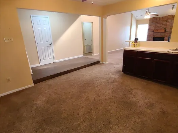 a room with a sink and a mirror