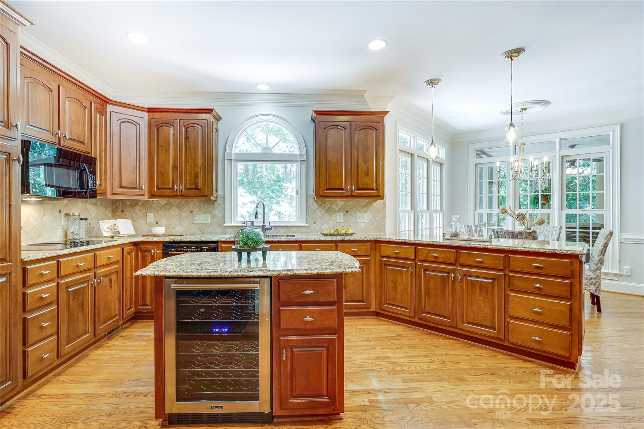 2500 High Ridge Road Charlotte, NC 28270 - Photo 15 of 47 a kitchen with stainless steel appliances granite countertop wooden cabinets a stove a sink and a large window