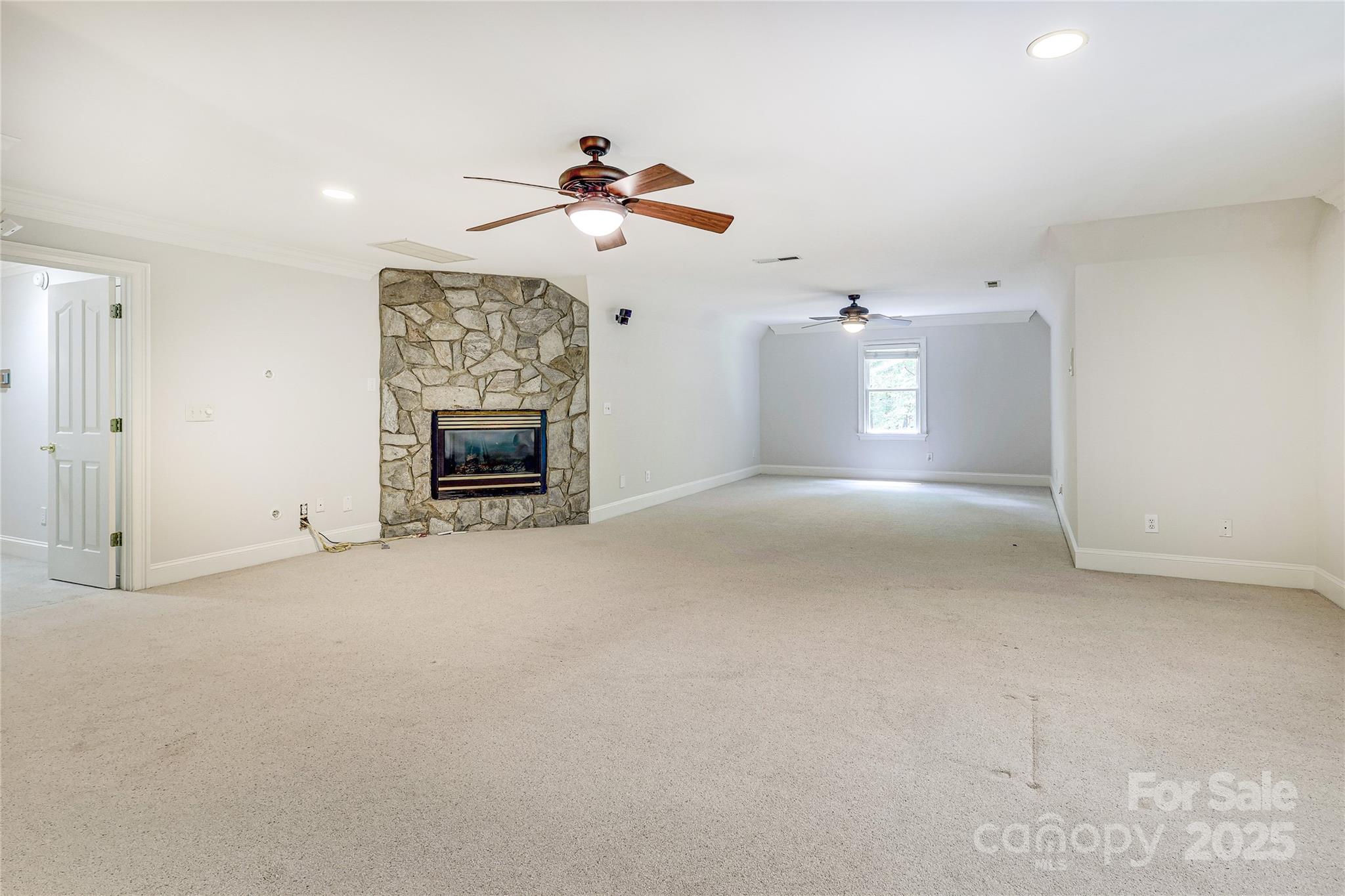 2500 High Ridge Road Charlotte, NC 28270 - Photo 30 of 47 a view of a livingroom with a fireplace and fan