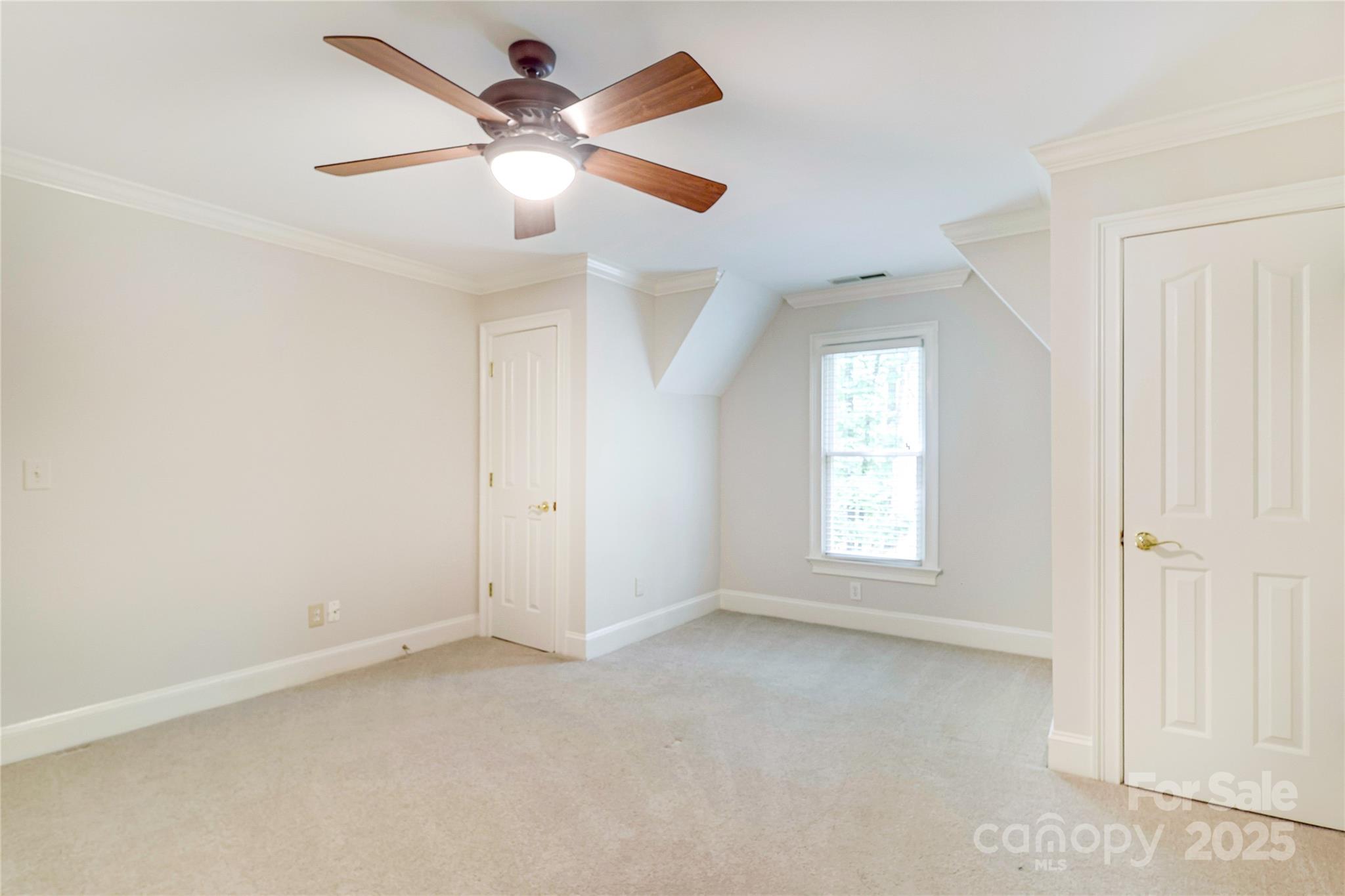 2500 High Ridge Road Charlotte, NC 28270 - Photo 33 of 47 an empty room with chandelier fan and windows