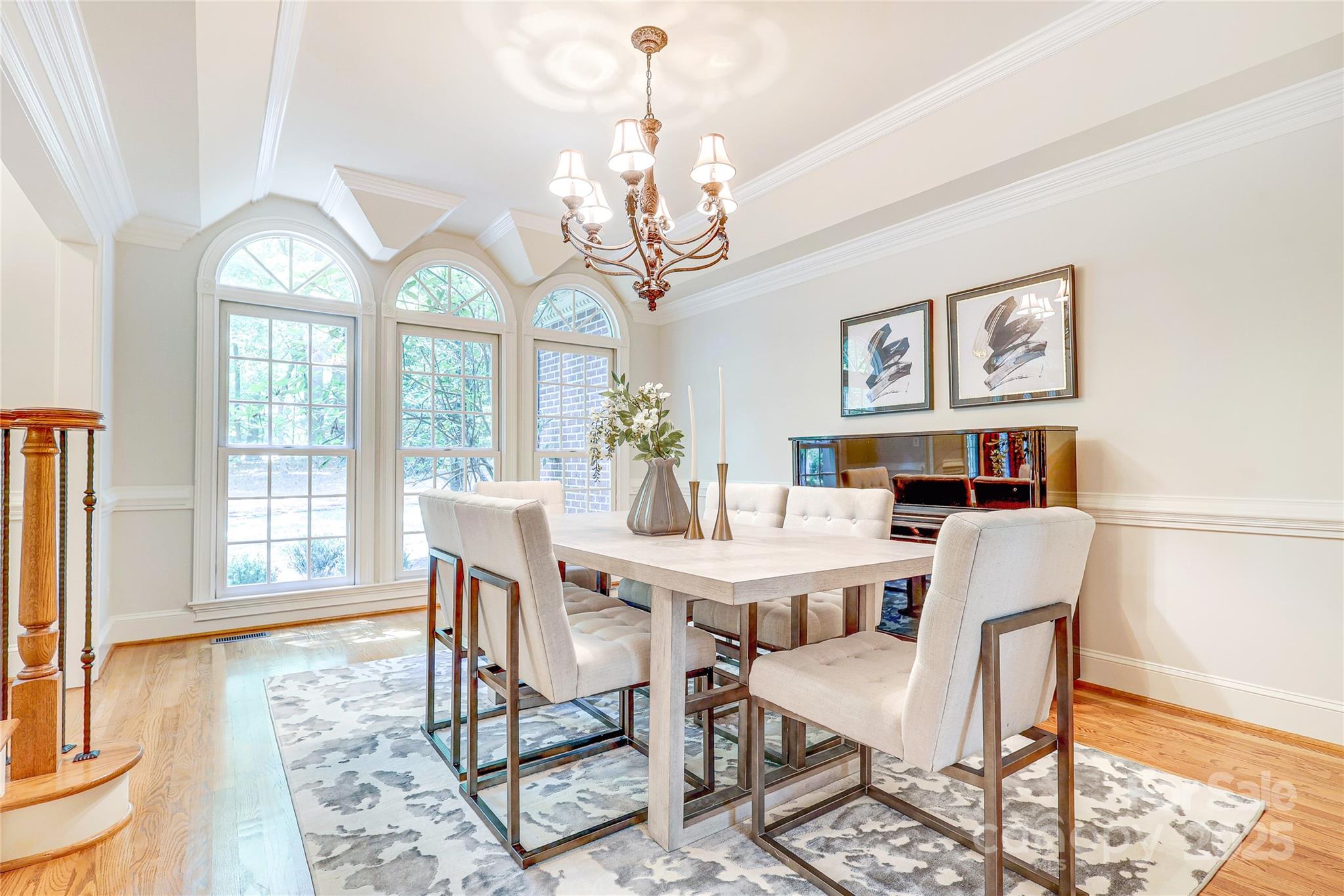 2500 High Ridge Road Charlotte, NC 28270 - Photo 6 of 47 a view of a dining room with furniture a chandelier and wooden floor