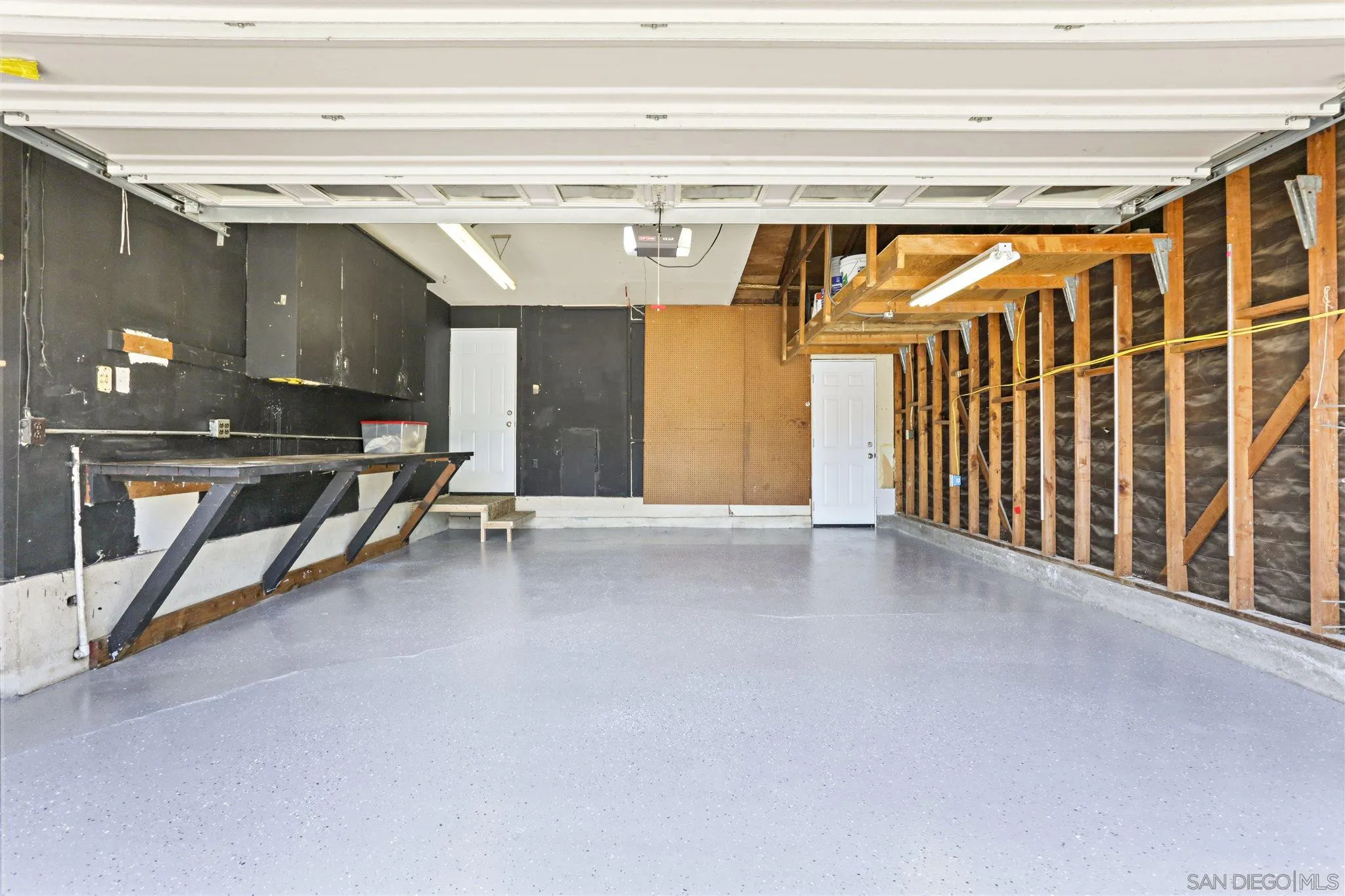 13726 Utopia Road Poway, CA 92064 - Photo 16 of 19 a view of a garage with wooden floor